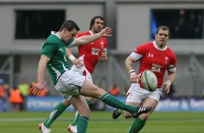 13.03.10 Ireland v Wales... Ireland's Jonathan Sexton kicks in front of Paul James. 