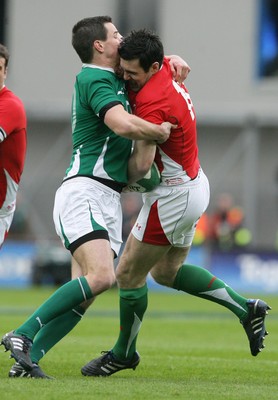 13.03.10 Ireland v Wales... Wales Stephen Jones is tackled by Ireland's Jonathan Sexton. 