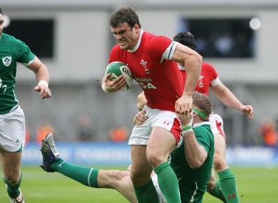 13.03.10 Ireland v Wales... Wales Jamie Roberts is tackled by Ireland's Jamie Heaslip. 