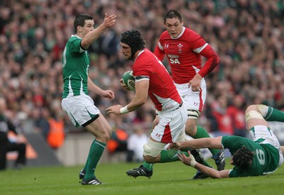 13.03.10 Ireland v Wales... Wales Luke Charteris is tackled by Ireland's Stephen Ferris. 