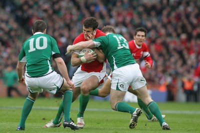 13.03.10 Ireland v Wales... Wales Jamie Roberts is tackled by Ireland's Brian O'Driscoll. 