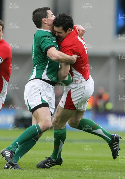 13.03.10 Ireland v Wales... Wales Stephen Jones is tackled by Ireland's Jonathan Sexton. 