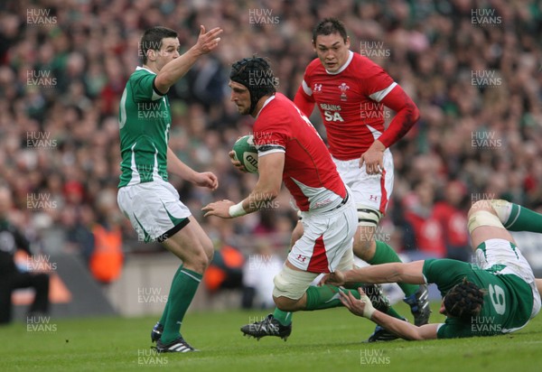 13.03.10 Ireland v Wales... Wales Luke Charteris is tackled by Ireland's Stephen Ferris. 