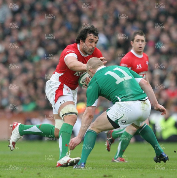 13.03.10 Ireland v Wales... Wales Jonathan Thomas is tackled by Ireland's Keith Earl. 