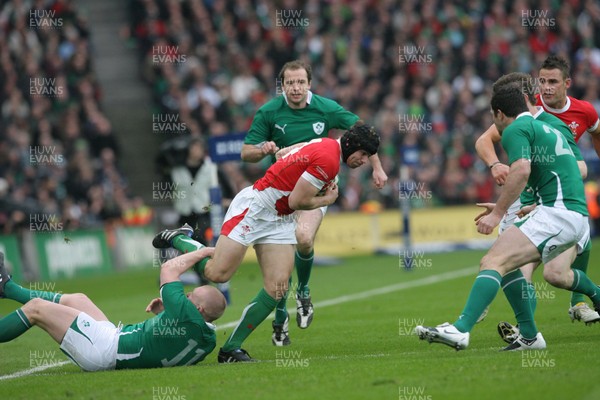 13.03.10 Ireland v Wales... Wales Leigh Halfpenny is tackled by Ireland's Keith Earl. 