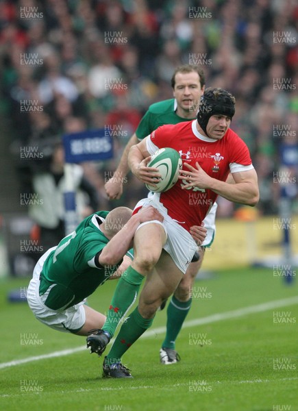 13.03.10 Ireland v Wales... Wales Leigh Halfpenny is tackled by Ireland's Keith Earl. 