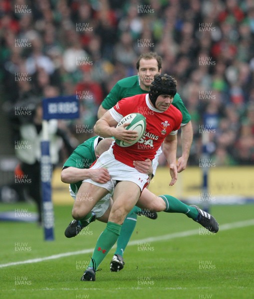13.03.10 Ireland v Wales... Wales Leigh Halfpenny is tackled by Ireland's Keith Earl. 