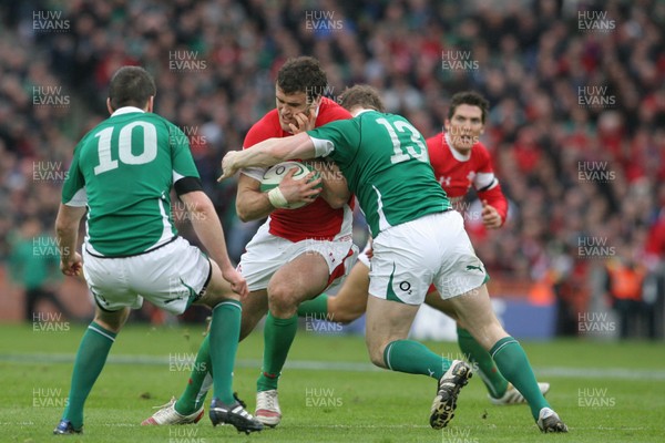 13.03.10 Ireland v Wales... Wales Jamie Roberts is tackled by Ireland's Brian O'Driscoll. 