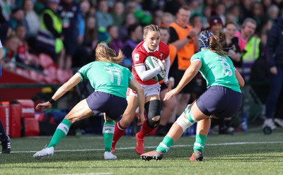 130424 - Ireland  v Wales, Guinness Women’s 6 Nations - Jasmine Joyce of Wales takes on Beibhinn Parsons of Ireland and Brittany Hogan of Ireland