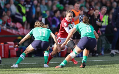 130424 - Ireland  v Wales, Guinness Women’s 6 Nations - Jasmine Joyce of Wales takes on Beibhinn Parsons of Ireland and Brittany Hogan of Ireland