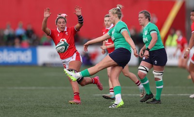 130424 - Ireland  v Wales, Guinness Women’s 6 Nations - Georgia Evans of Wales looks to change down the kick from Dannah O’Brien of Ireland