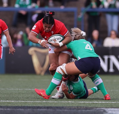 130424 - Ireland  v Wales, Guinness Women’s 6 Nations - Sisilia Tuipulotu of Wales takes on Brittany Hogan of Ireland and Dorothy Wall of Ireland