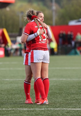 130424 - Ireland  v Wales, Guinness Women’s 6 Nations - Hannah Jones of Wales and Jasmine Joyce of Wales embrace at the end of the match