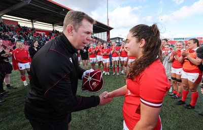 130424 - Ireland  v Wales, Guinness Women’s 6 Nations - Ioan Cunningham, Wales Women head coach, presents Gwennan Hopkins of Wales with her first cap