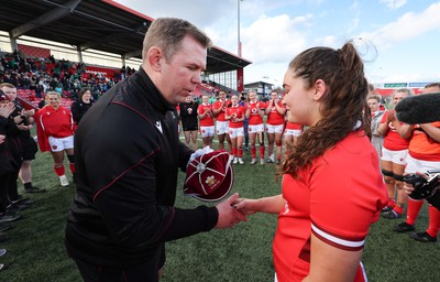 130424 - Ireland  v Wales, Guinness Women’s 6 Nations - Ioan Cunningham, Wales Women head coach, presents Gwennan Hopkins of Wales with her first cap