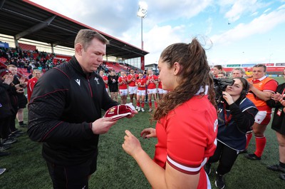 130424 - Ireland  v Wales, Guinness Women’s 6 Nations - Ioan Cunningham, Wales Women head coach, presents Gwennan Hopkins of Wales with her first cap