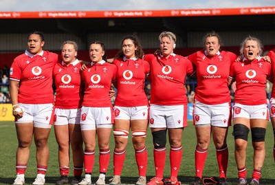 130424 - Ireland  v Wales, Guinness Women’s 6 Nations - Left to right, Sisilia Tuipulotu, Molly Reardon, Sian Jones, Gwennan Hopkins, Donna Rose, Carys Phillips and Alex Callender during the Welsh national anthem