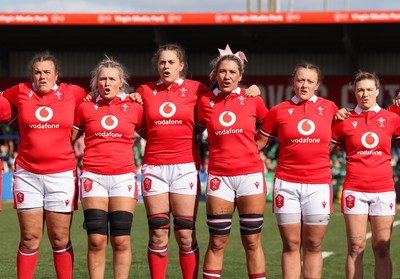 130424 - Ireland  v Wales, Guinness Women’s 6 Nations - Left to right, Carys Phillips, Alex Callender, Natalia John, Georgia Evans, Lleucu George and Keira Bevan during the Welsh national anthem