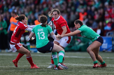 130424 - Ireland  v Wales, Guinness Women’s 6 Nations - Courtney Keight of Wales is held by the Irish defence