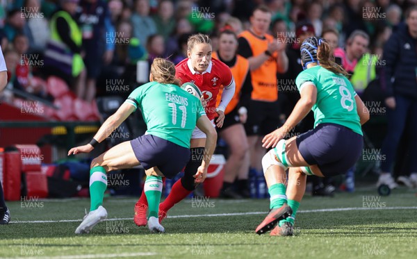 130424 - Ireland  v Wales, Guinness Women’s 6 Nations - Jasmine Joyce of Wales takes on Beibhinn Parsons of Ireland and Brittany Hogan of Ireland
