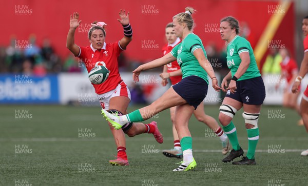 130424 - Ireland  v Wales, Guinness Women’s 6 Nations - Georgia Evans of Wales looks to change down the kick from Dannah O’Brien of Ireland