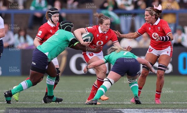 130424 - Ireland  v Wales, Guinness Women’s 6 Nations - Jenny Hesketh of Wales takes on Linda Djougang of Ireland and Edel McMahon of Ireland