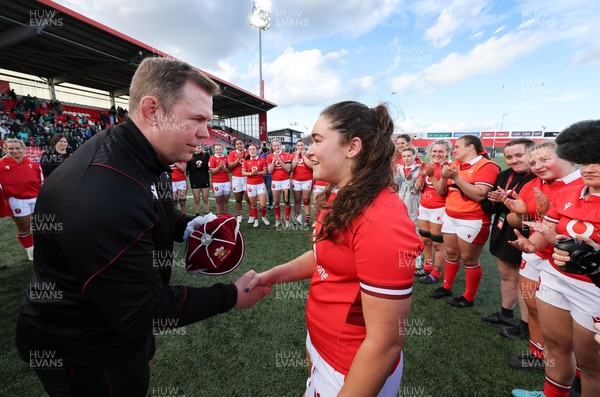130424 - Ireland  v Wales, Guinness Women’s 6 Nations - Ioan Cunningham, Wales Women head coach, presents Gwennan Hopkins of Wales with her first cap