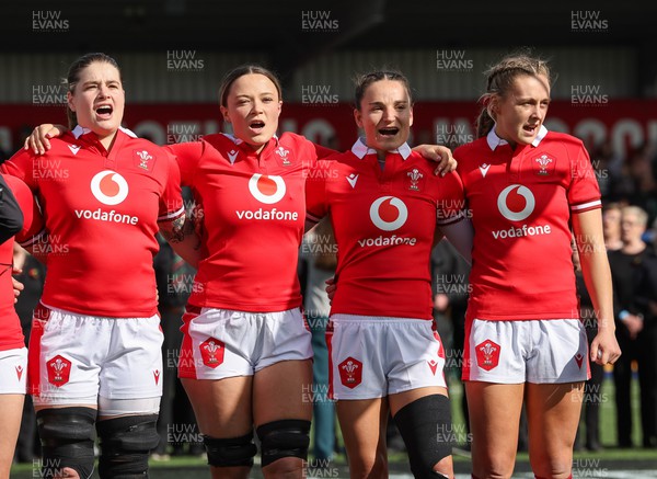 130424 - Ireland  v Wales, Guinness Women’s 6 Nations - Left to right, Bethan Lewis, Alisha Butchers, Jasmine Joyce and Hannah Jones during the Welsh National Anthem
