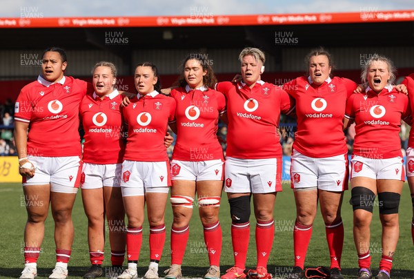 130424 - Ireland  v Wales, Guinness Women’s 6 Nations - Left to right, Sisilia Tuipulotu, Molly Reardon, Sian Jones, Gwennan Hopkins, Donna Rose, Carys Phillips and Alex Callender during the Welsh national anthem