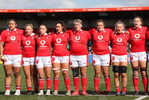 130424 - Ireland  v Wales, Guinness Women’s 6 Nations - Left to right, Sisilia Tuipulotu, Molly Reardon, Sian Jones, Gwennan Hopkins, Donna Rose, Carys Phillips and Alex Callender and Natalia John during the Welsh national anthem