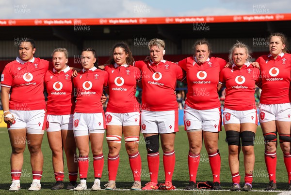 130424 - Ireland  v Wales, Guinness Women’s 6 Nations - Left to right, Sisilia Tuipulotu, Molly Reardon, Sian Jones, Gwennan Hopkins, Donna Rose, Carys Phillips and Alex Callender and Natalia John during the Welsh national anthem
