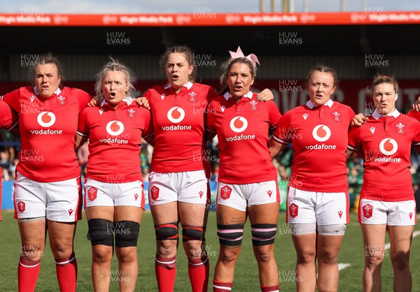 130424 - Ireland  v Wales, Guinness Women’s 6 Nations - Left to right, Carys Phillips, Alex Callender, Natalia John, Georgia Evans, Lleucu George and Keira Bevan during the Welsh national anthem