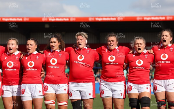 130424 - Ireland  v Wales, Guinness Women’s 6 Nations - Left to right, Molly Reardon, Sian Jones, Gwennan Hopkins, Donna Rose, Carys Phillips, Alex Callender and Natalia John during the Welsh national anthem
