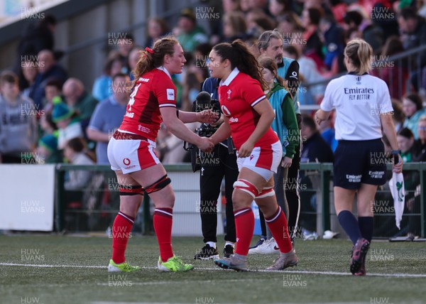 130424 - Ireland  v Wales, Guinness Women’s 6 Nations - Abbie Fleming of Wales, left, shakes hands with Gwennan Hopkins of Wales as she comes on to replace her