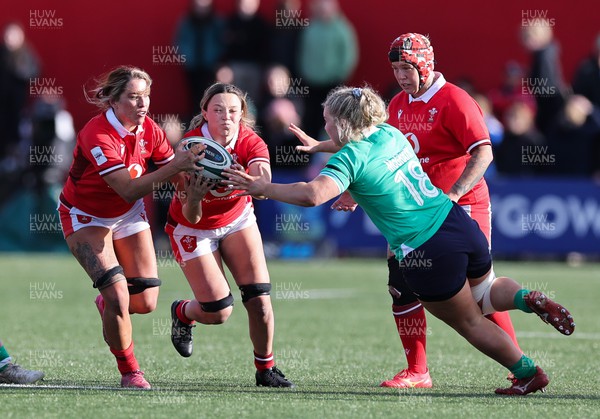 130424 - Ireland  v Wales, Guinness Women’s 6 Nations - Alisha Butchers of Wales and Georgia Evans of Wales win the ball from Sadhbh McGrath of Ireland