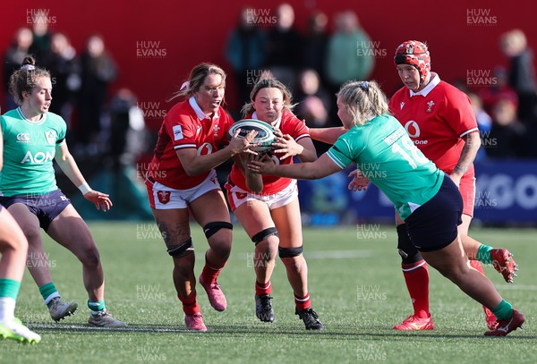 130424 - Ireland  v Wales, Guinness Women’s 6 Nations - Alisha Butchers of Wales and Georgia Evans of Wales win the ball from Sadhbh McGrath of Ireland