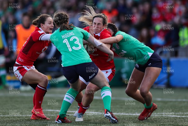 130424 - Ireland  v Wales, Guinness Women’s 6 Nations - Courtney Keight of Wales is held by the Irish defence