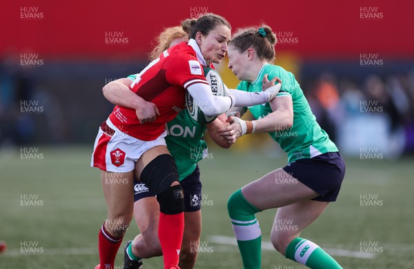 130424 - Ireland  v Wales, Guinness Women’s 6 Nations - Jasmine Joyce of Wales is held short of the line