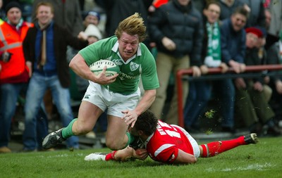 26.02.06..Ireland v Wales, Six Nations Irelands Jerry Flannery is tackled by Lee Byrne 