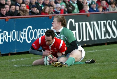 26.02.06  Ireland v Wales, Dublin  Wales Mark Jones scores try despite tackle by Andrew Trimble.  