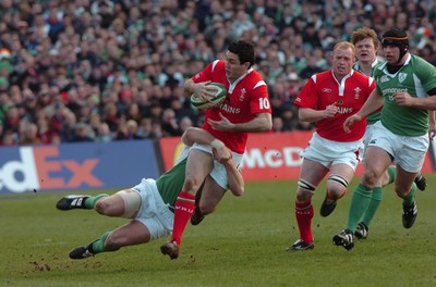 26.02.06  Ireland v Wales, Dublin  Wales Stephen Jones is tackled by David Wallace.  