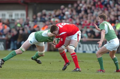 26.02.06  Ireland v Wales, Dublin  Wales Michael Owen is tackled by Malcom O'Kelly.   