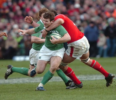 26.02.06  Ireland v Wales, Dublin  Gordon D'Arcy is tackled by Robert Sidoli  