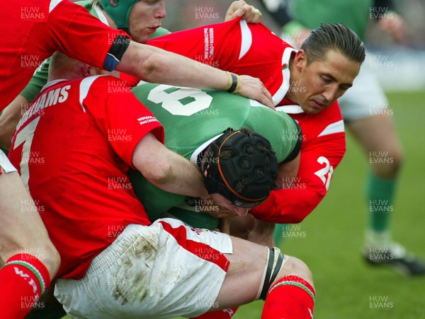 26.02.06..Ireland v Wales, Six Nations Irelands Denis Leamy is tackled by Gavin Henson and Martyn Williams to prevent try 