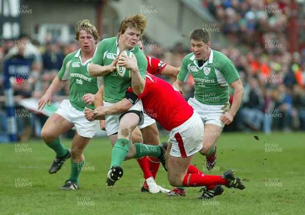 26.02.06..Ireland v Wales, Six Nations Irelands Brian O'Driscoll is tackled by Rhys Thomas 