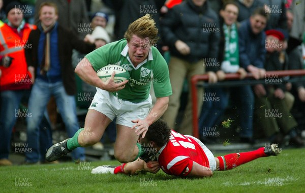 26.02.06..Ireland v Wales, Six Nations Irelands Jerry Flannery is tackled by Lee Byrne 