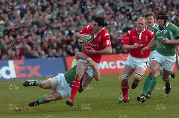 26.02.06  Ireland v Wales, Dublin  Wales Stephen Jones is tackled by David Wallace.  
