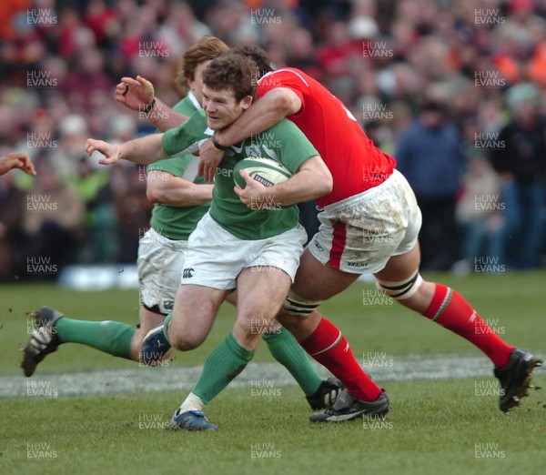 26.02.06  Ireland v Wales, Dublin  Gordon D'Arcy is tackled by Robert Sidoli  