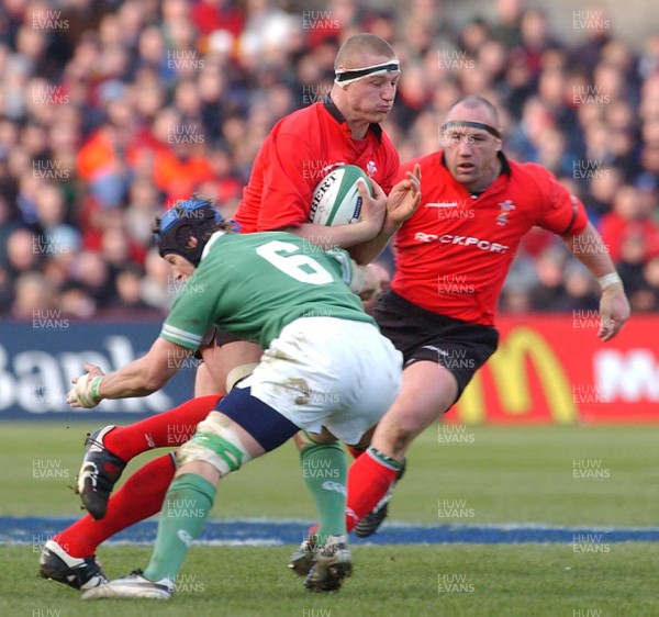 22.02.04  Ireland v Wales  Wales Brent Cockbain is tackled by Simon Easterby  Huw Evans,Cardiff