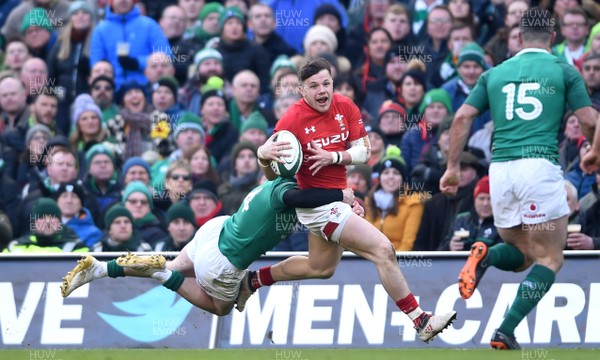 240218 - Ireland v Wales - NatWest 6 Nations 2018 - Steff Evans of Wales is tackled by Keith Earls of Ireland